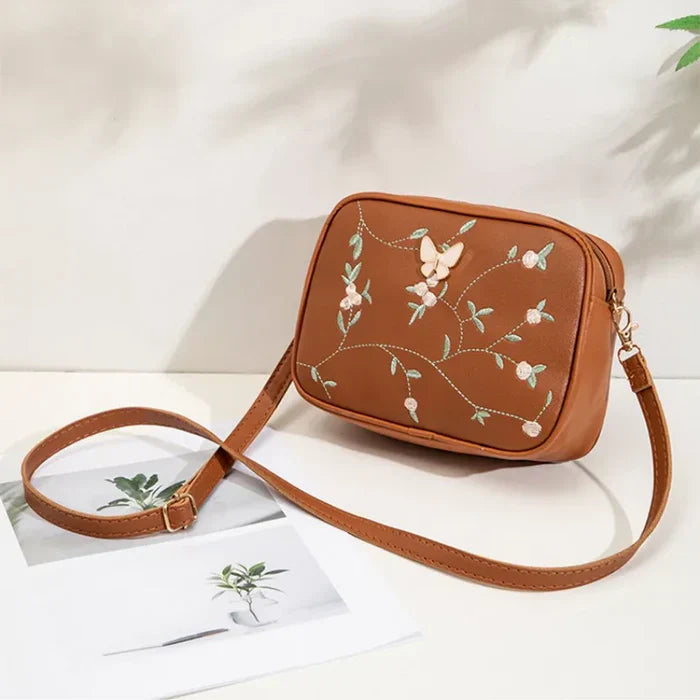 Floral Embroidered Crossbody Bag with Butterfly Charm Brown