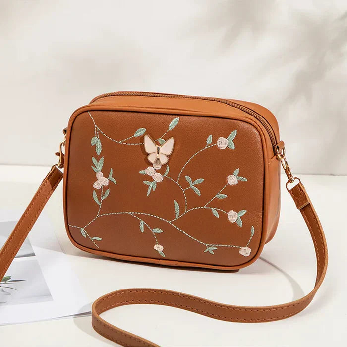 Floral Embroidered Crossbody Bag with Butterfly Charm Brown